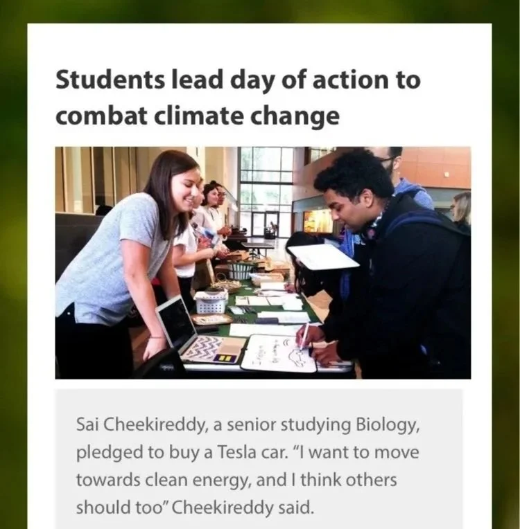 Students at a booth discussing climate change actions